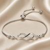 Sliding bracelet with infinity symbol in white gold