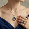 Blue crystal necklace + earring set in gold with blue crystal